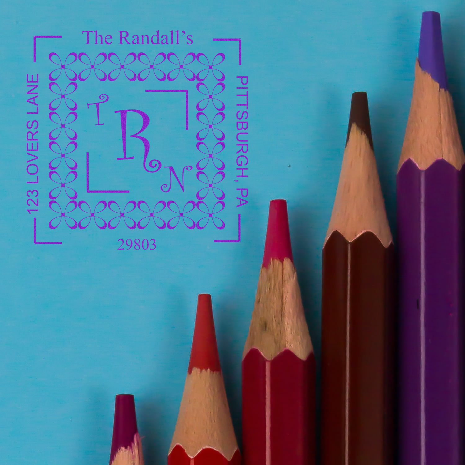 Custom address rubber stamp for The Randalls, with monogram, decorative border, and Pittsburgh, PA 123 Lovers Lane address.