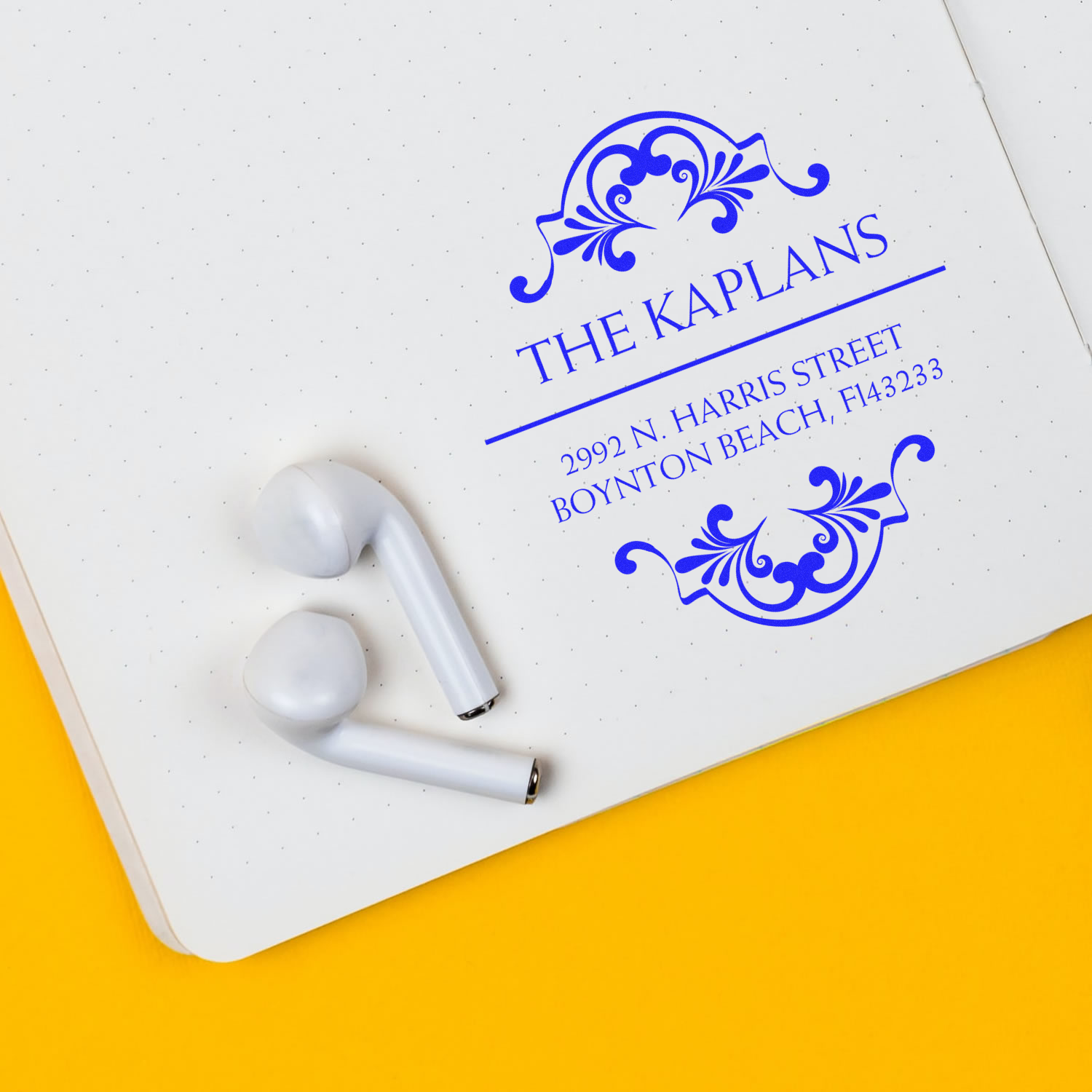 Stethoscope on branded white card with The Kaplan's logo and address, 1992 N. Harris St, Boynton Beach FL 33433.