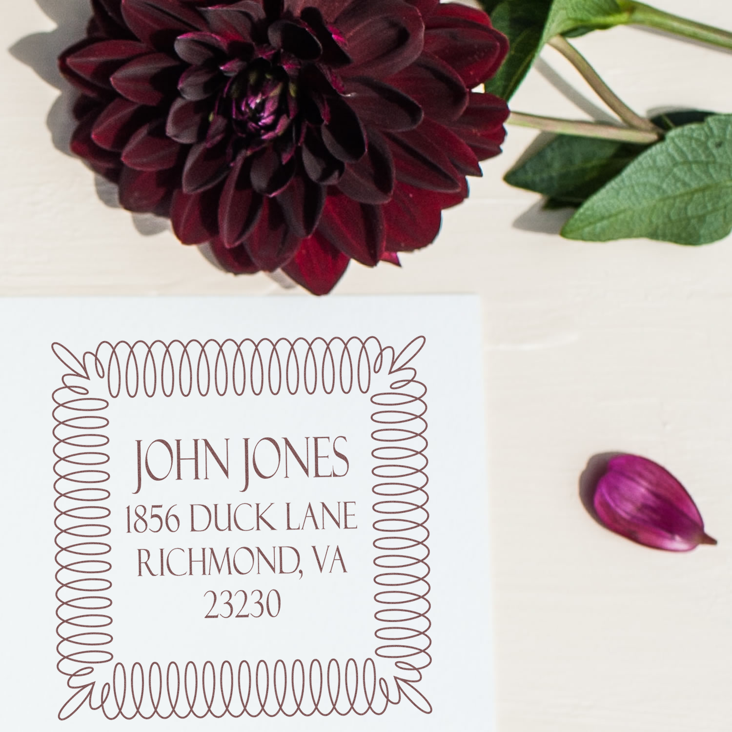 Custom floral return address rubber stamp with dahlia design and John Jones, Richmond, VA.