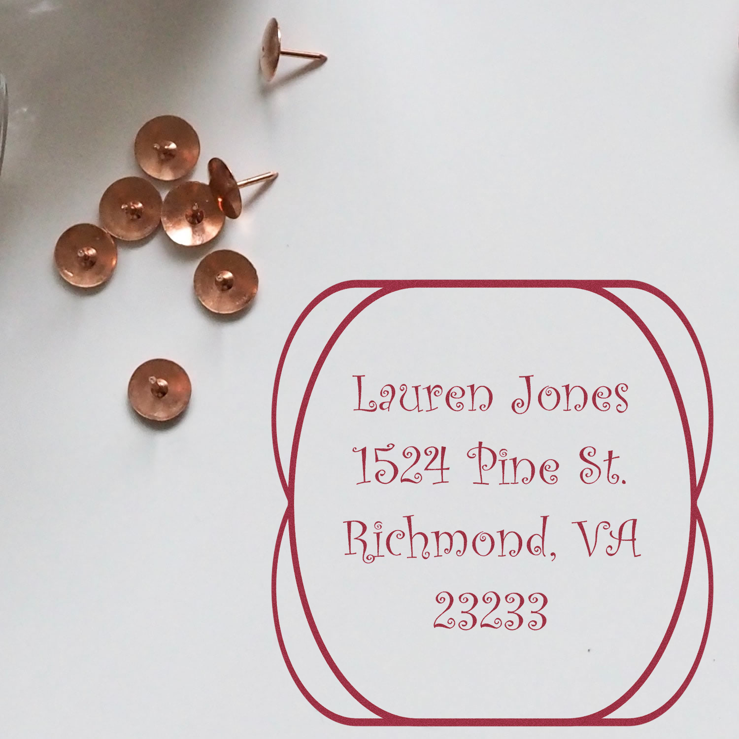 Custom return address rubber stamp proof for Lauren Jones, 1524 Pine St., Richmond, VA 23233, with copper fasteners.