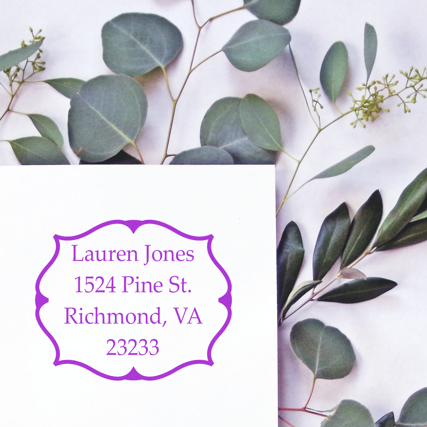 Custom address rubber stamp with purple floral frame for Lauren Jones, Richmond, VA return mailing labels.
