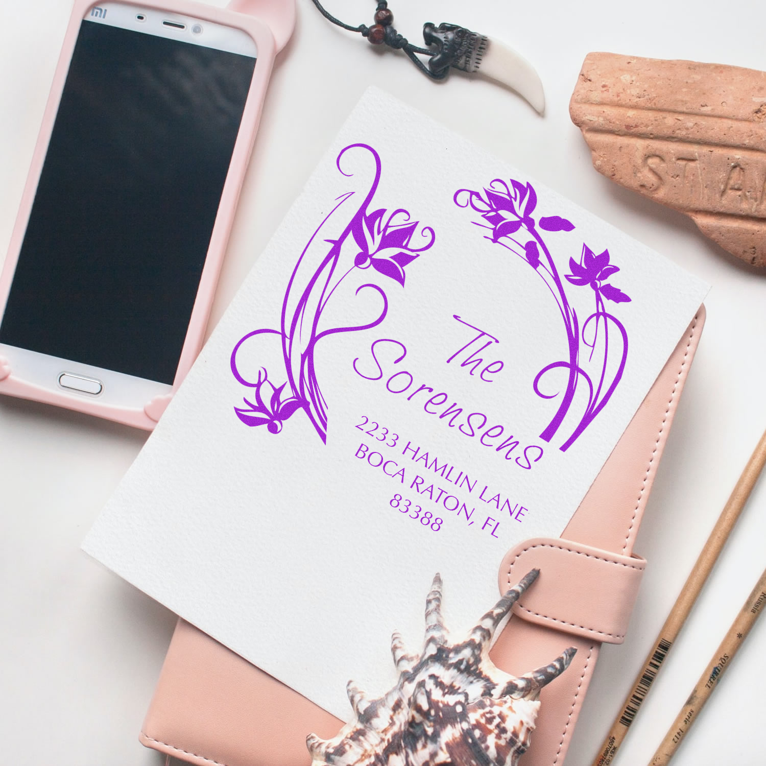 Handwritten-style purple floral design on personalized stationery with phone and Boca Raton address details for custom branding