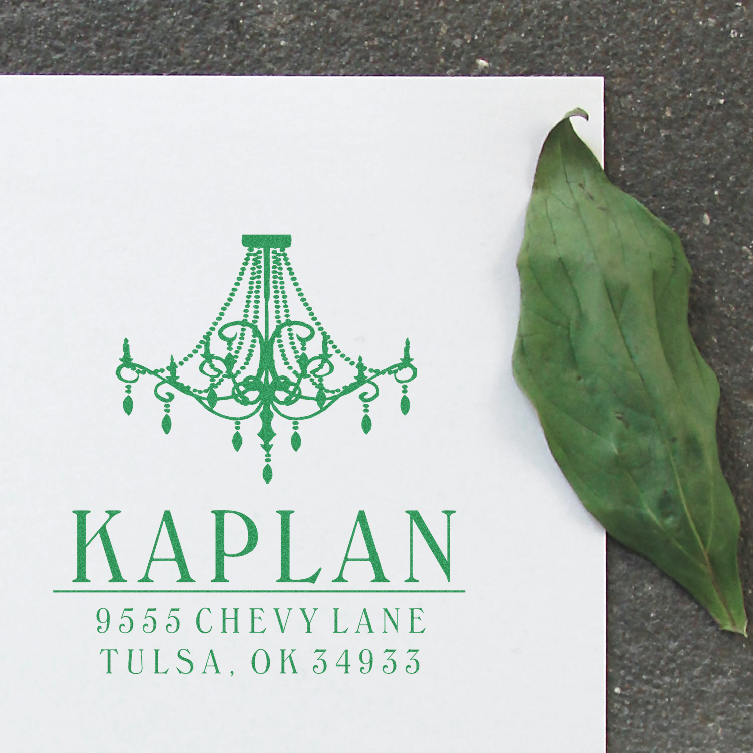 Personalized chandelier return address rubber stamp with Kaplan name and Tulsa, OK address in green ink