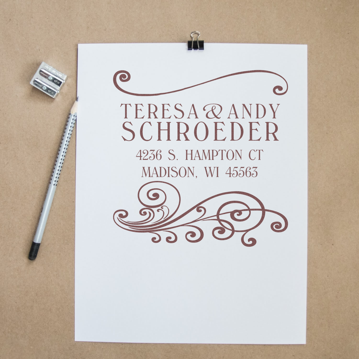 Custom address rubber stamp proof with decorative swirls for Teresa and Andy Schroeder, Madison, WI.