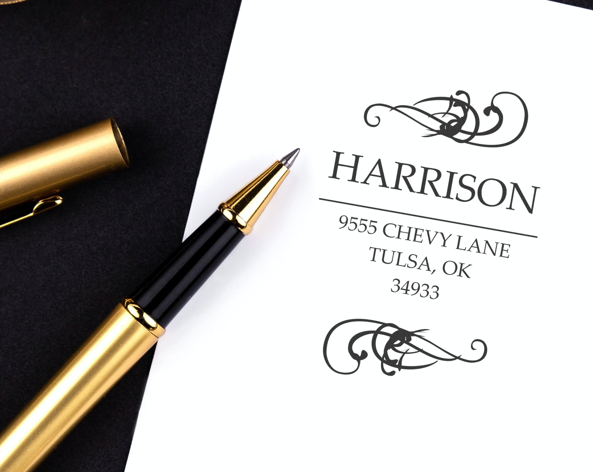 Personalized address rubber stamp featuring Harrison name, decorative monogram, and Tulsa, OK return address.
