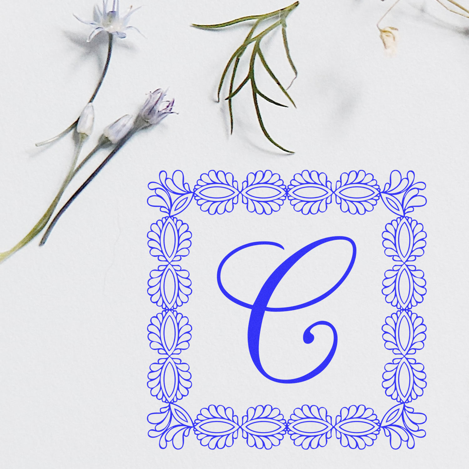 Floral monogram rubber stamp with ornate blue border and letter C, perfect for wedding stationery and personalized crafts