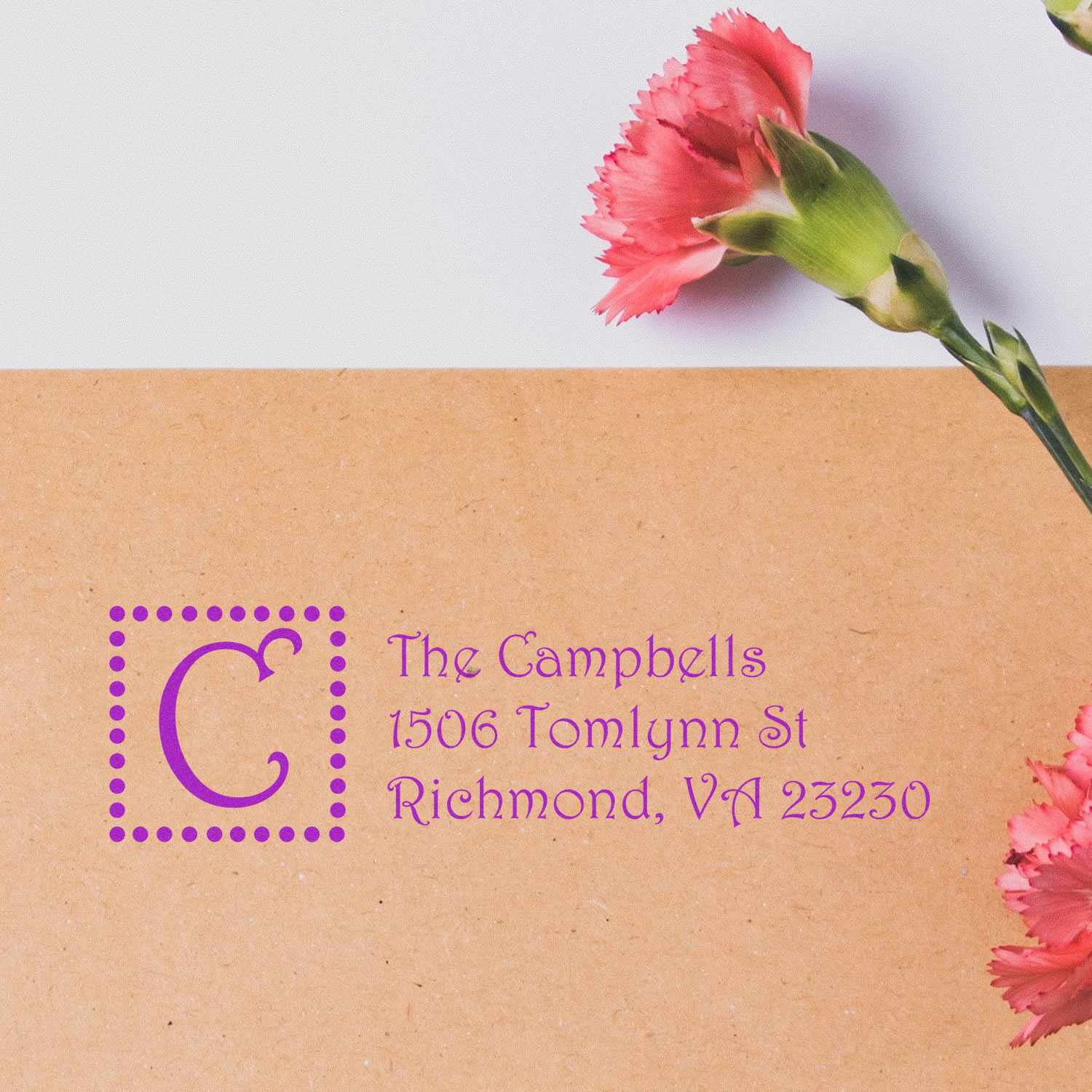 Custom address rubber stamp impression for The Campbells, Richmond, VA, on kraft envelope.