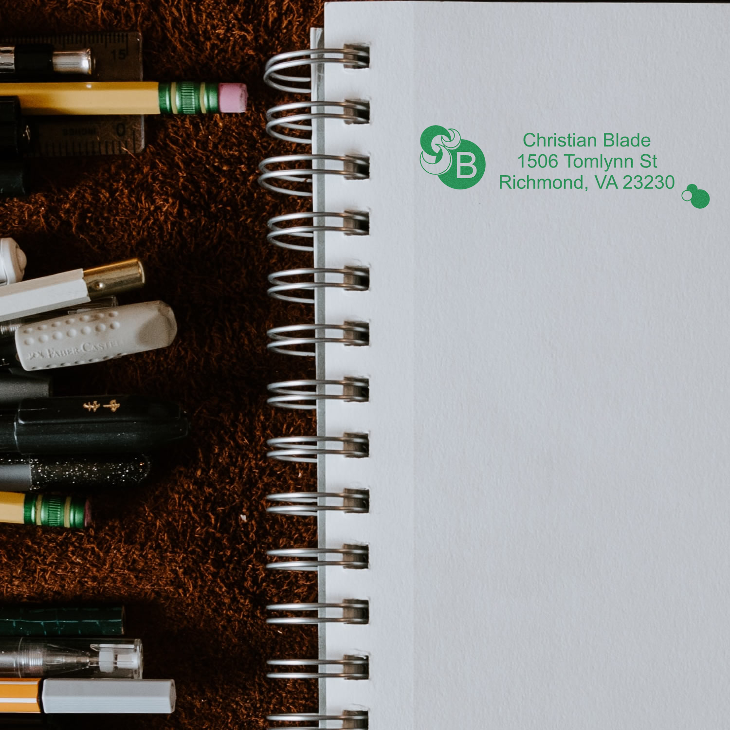 Custom rubber stamp return address on notebook page, showing Christian Blade logo and Richmond, VA address.