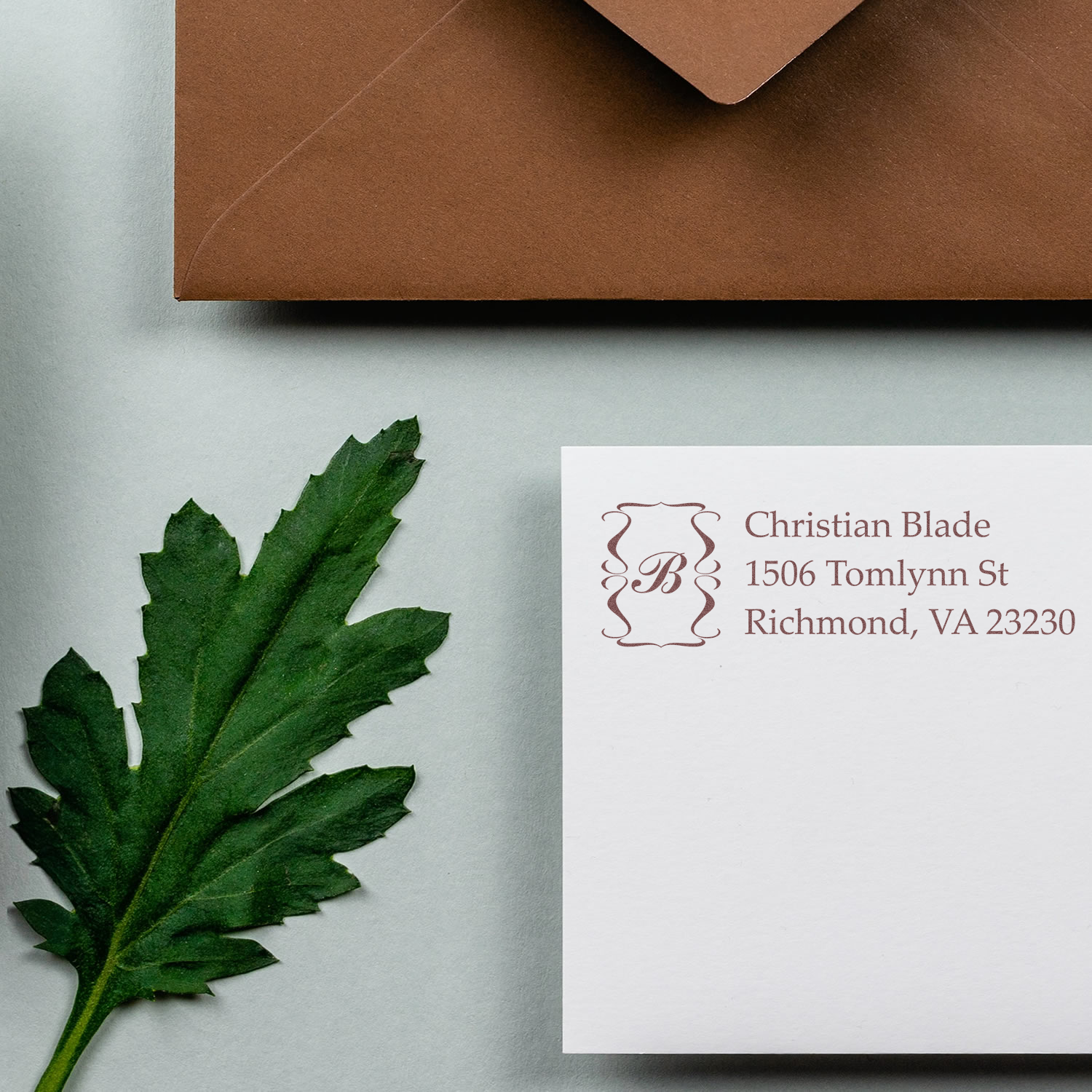 Custom return address rubber stamp on white envelope with name and Richmond, VA address for elegant wedding or business mail.