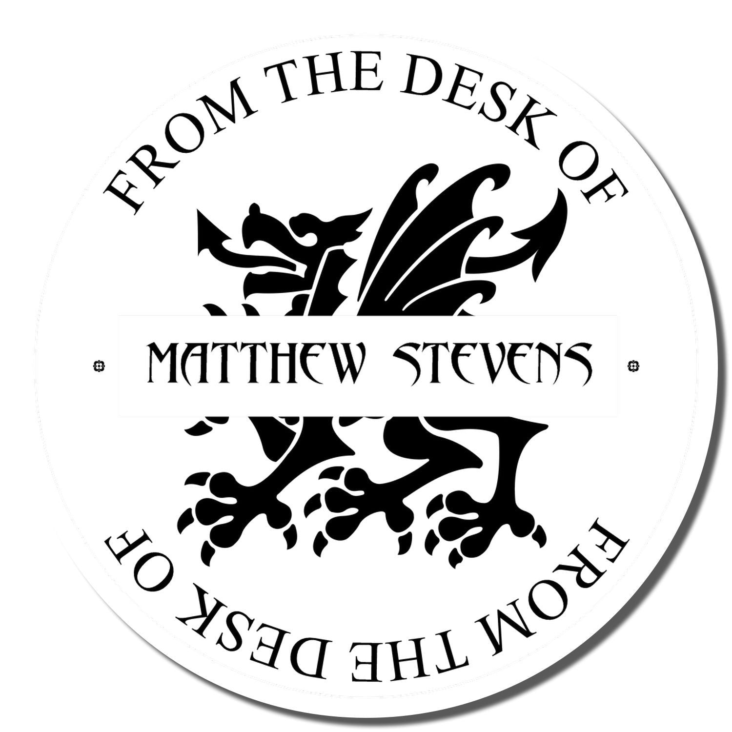 Personalized office rubber stamp reading From the Desk of Matthew Stevens with ornate dragon crest design.