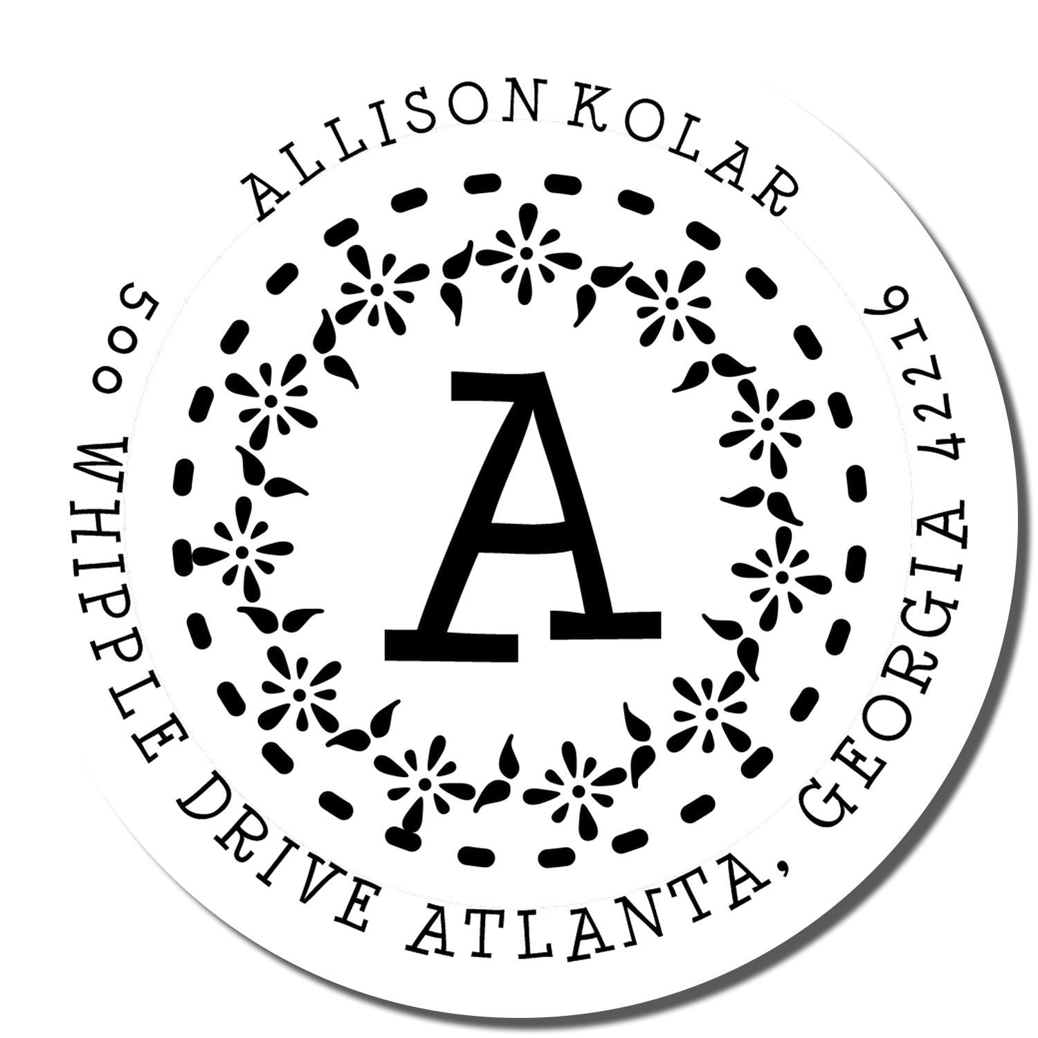 Personalized circular return address rubber stamp with floral monogram A and name for custom mail branding.