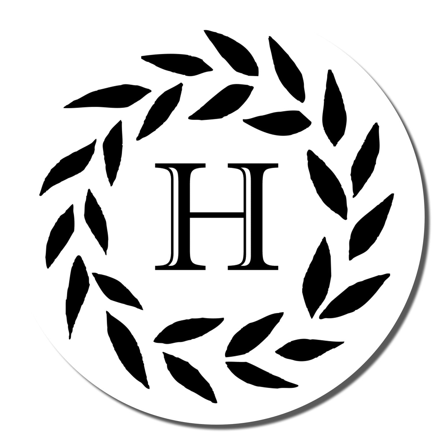 Custom H monogram rubber stamp design with laurel leaf wreath for wedding, branding, or stationery.