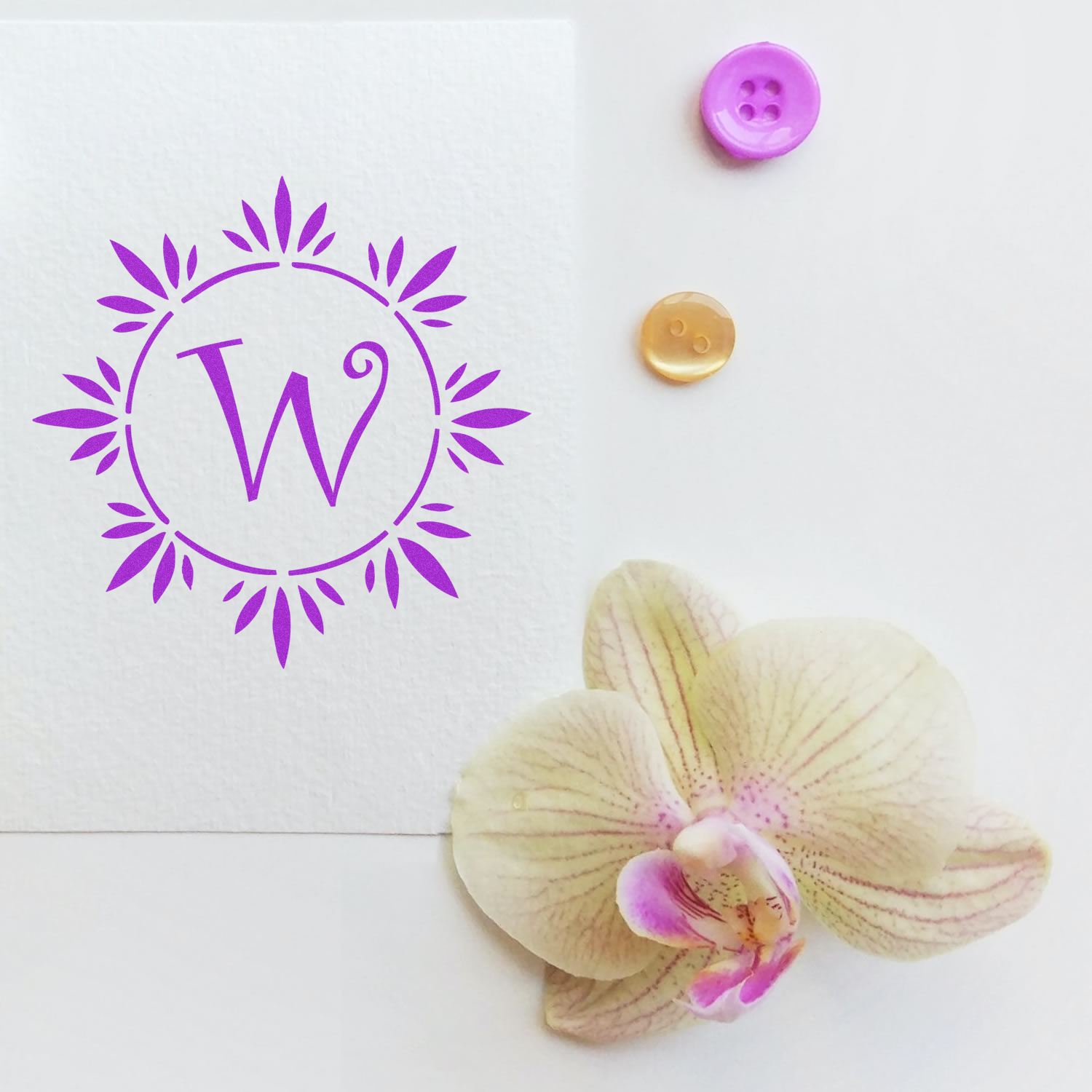 Personalized monogram W rubber stamp with floral wreath design for stationery, crafts, and branding.