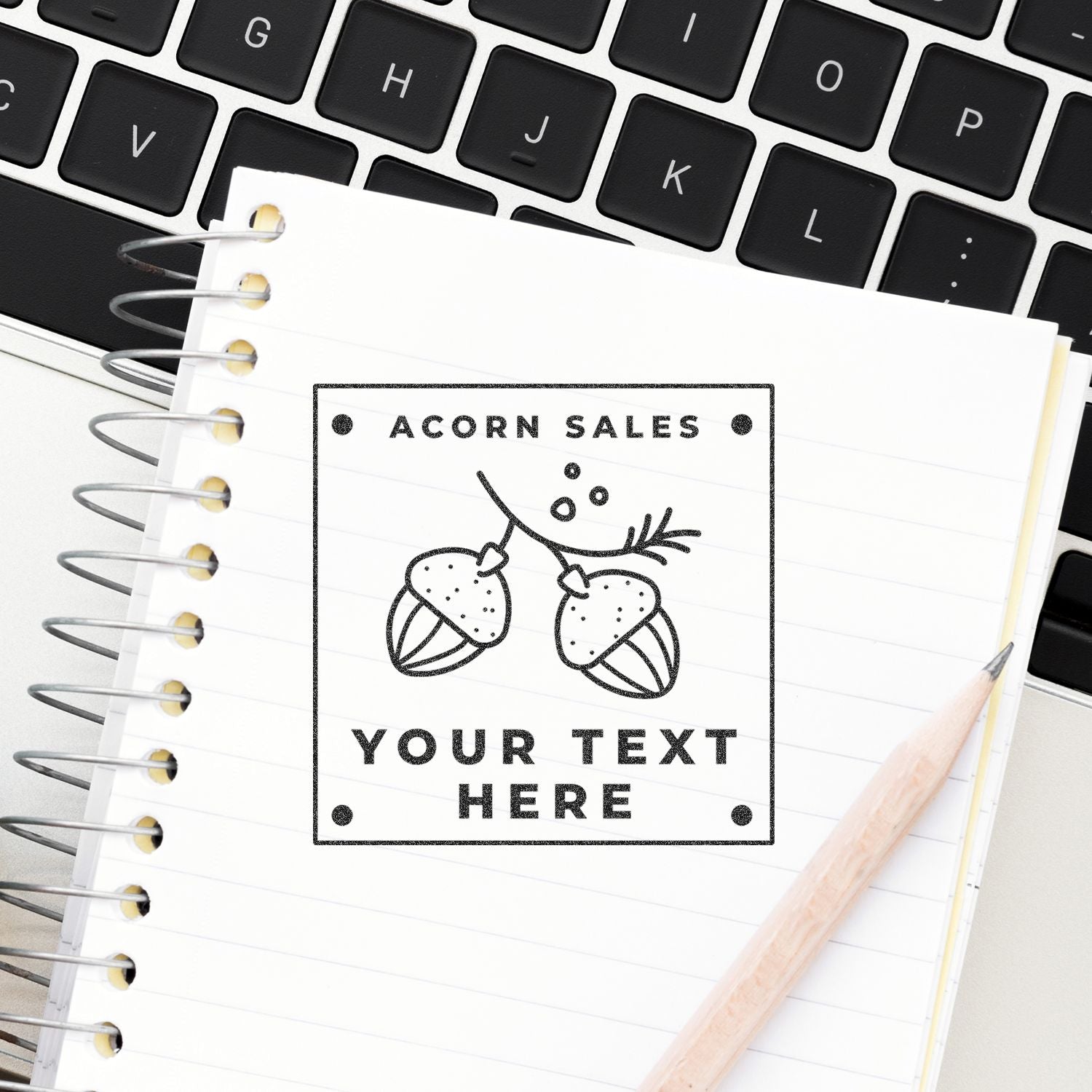 Customizable Acorn Sales notebook design on a laptop keyboard with pencil and spiral notebook, ideal for autumn business branding and text personalization