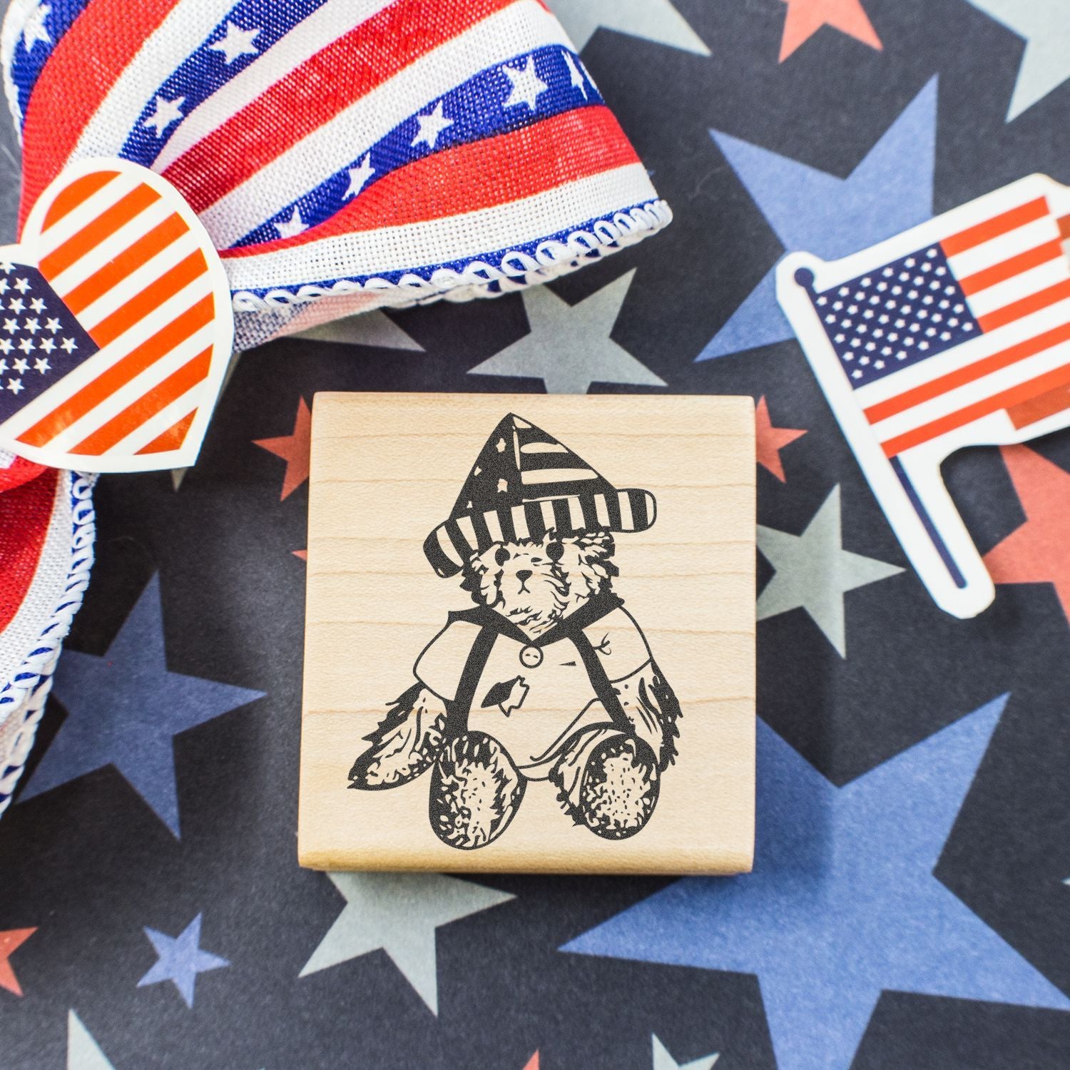 Patriotic Americana craft image with American flag decorations, star background, and a teddy bear stamp design