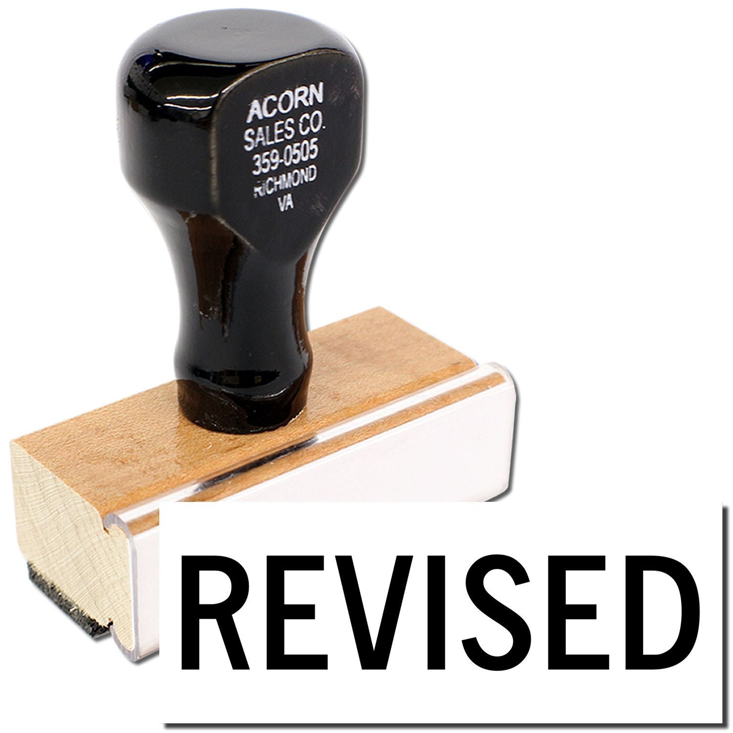 Acorn Sales Co. revised rubber stamp on wooden block, used for marking document revisions and updates