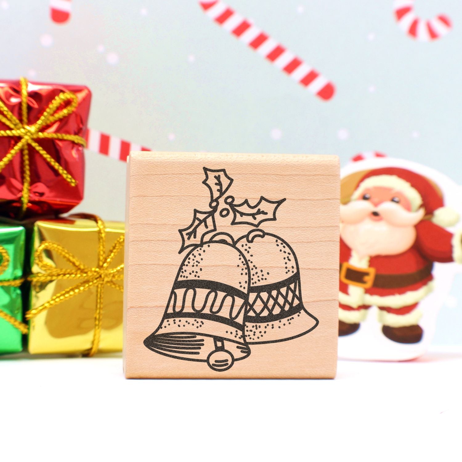 Christmas gift stamp with bells, Santa Claus, and festive wrapped presents holiday decoration