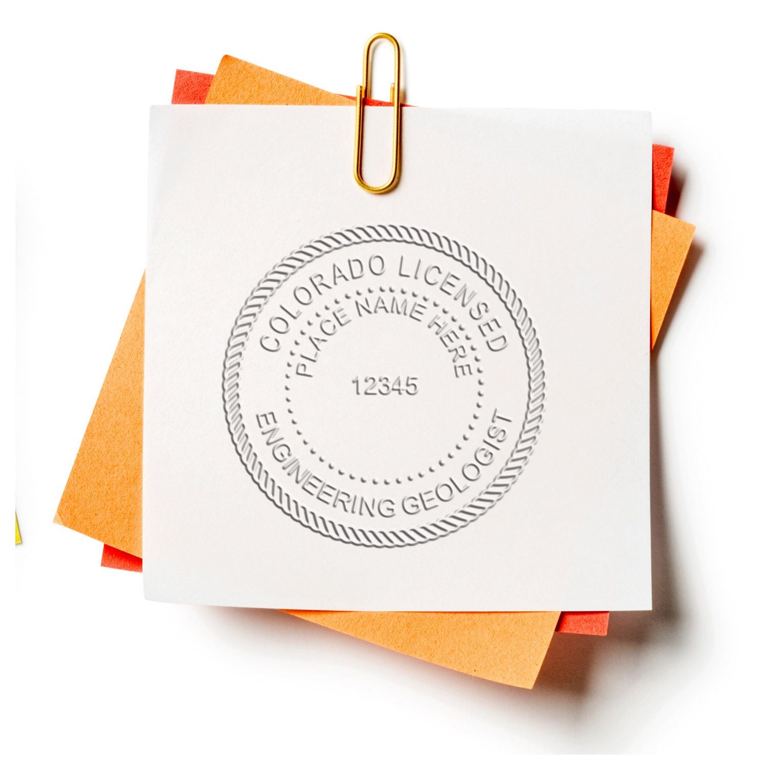 Embossed Colorado licensed engineering geologist stamp on paper clipped to colorful sticky notes.