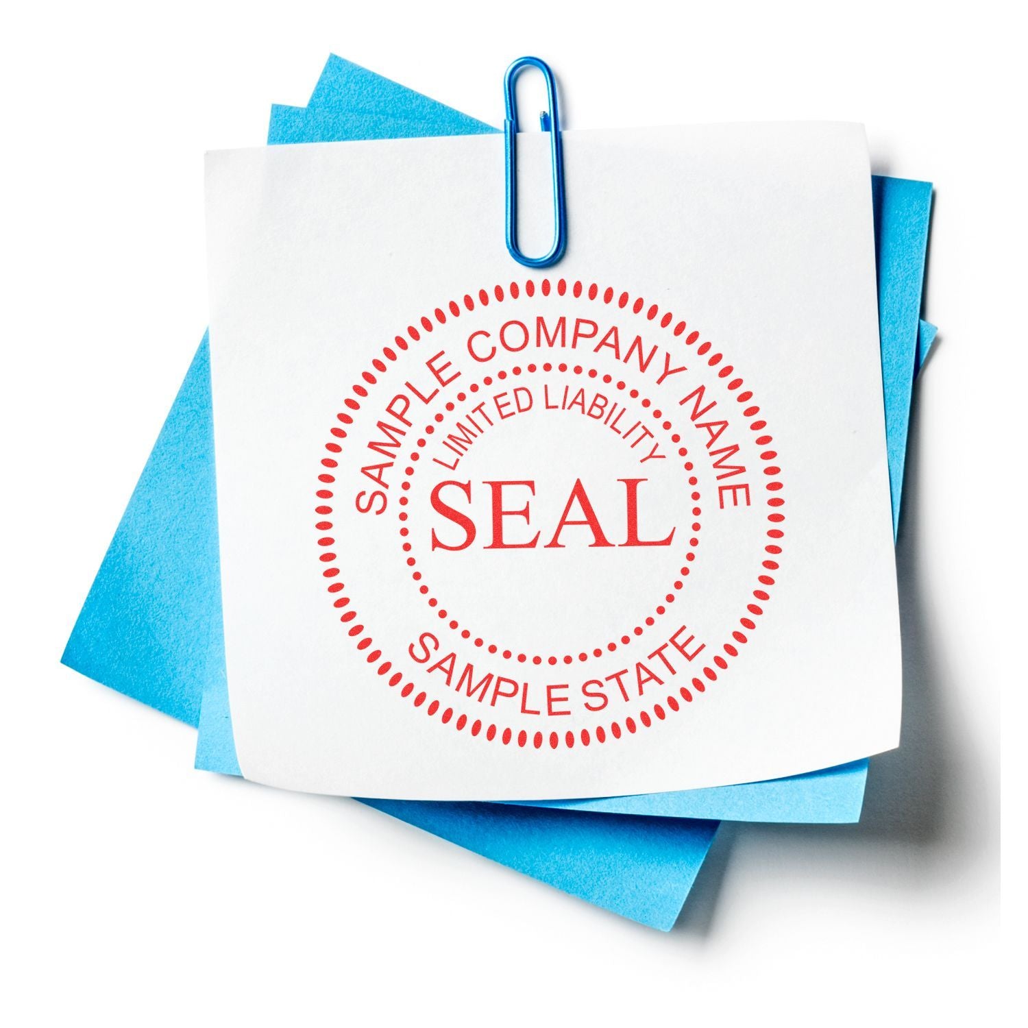 Business document with sample company limited liability seal, paper clip, and blue sticky notes on white background
