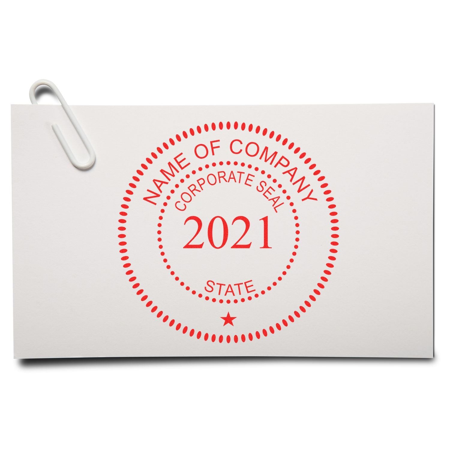 White business document with red 2021 corporate seal stamp and paperclip on top left.