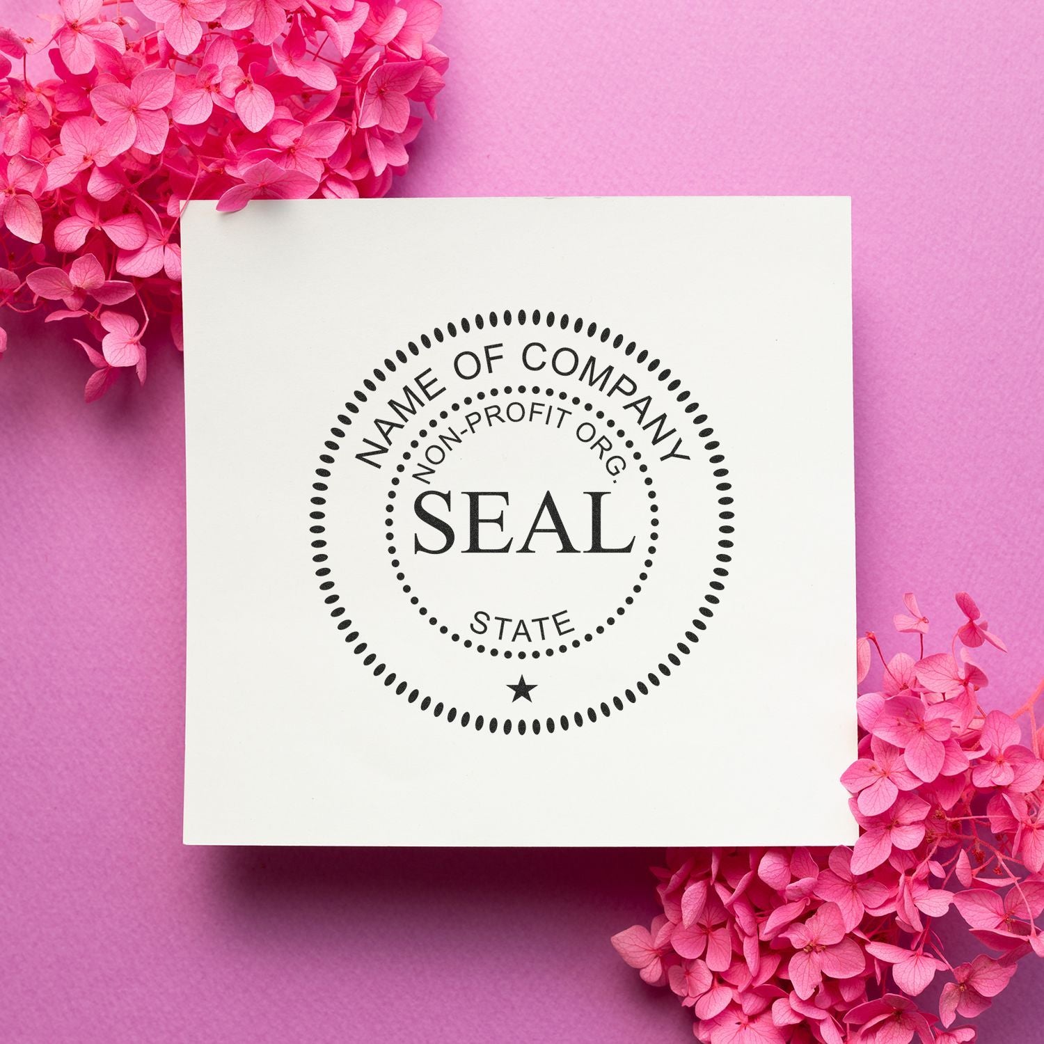 Pink floral company seal stamp mockup on white card with non-profit organization logo on a pink background