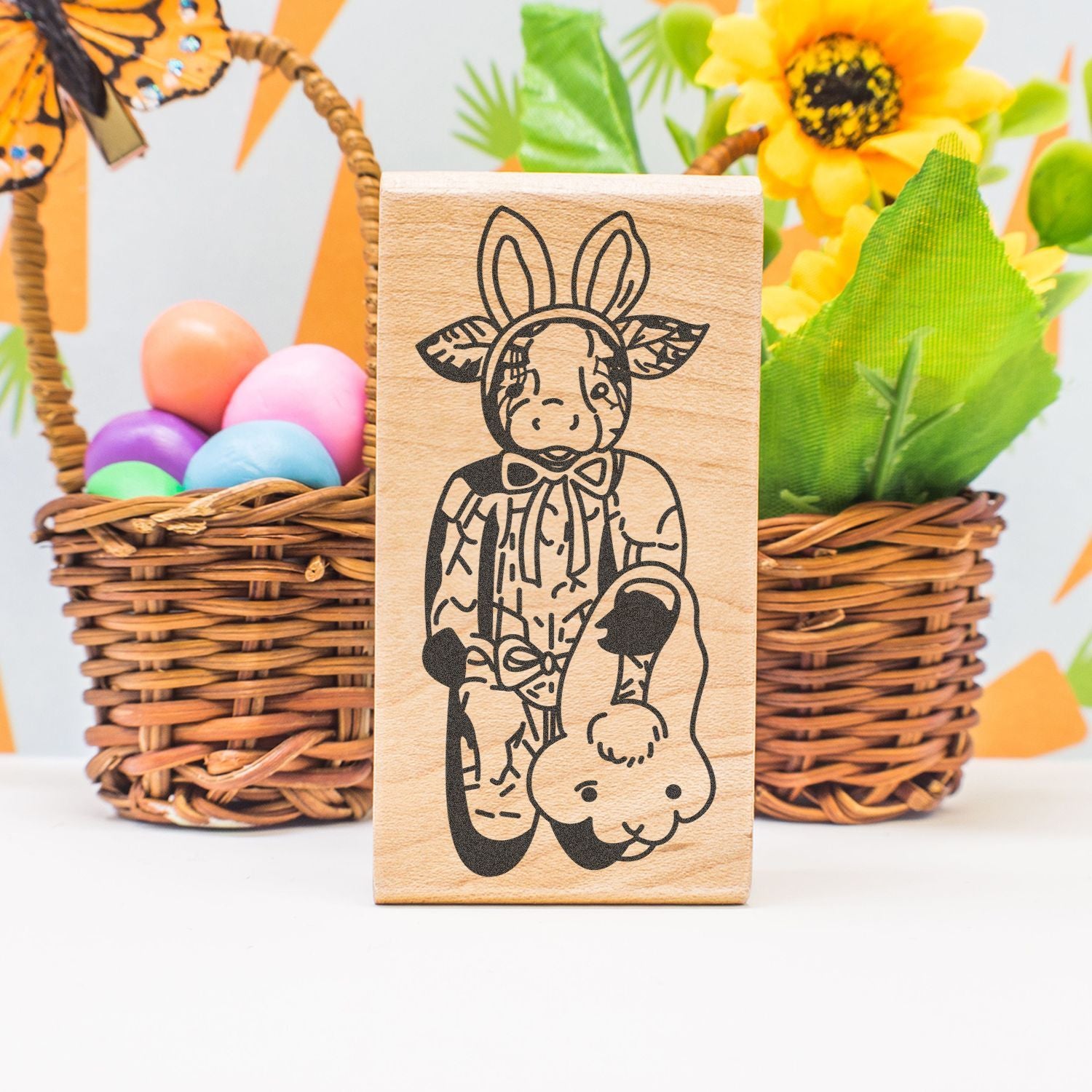 Wooden Easter bunny stamp with cute rabbit design, colorful eggs, and spring floral basket decor.