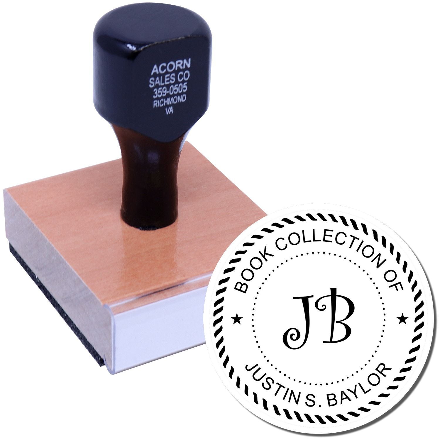 Custom book collection rubber stamp with JB monogram and Justin S. Baylor name, mounted on a wooden handle.