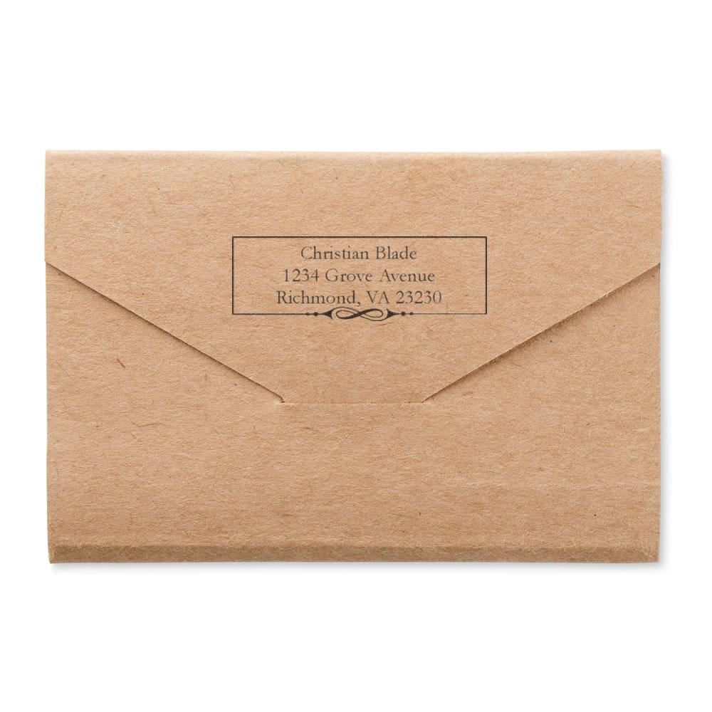 Custom return address rubber stamp on kraft envelope with name and Richmond, VA mailing address.