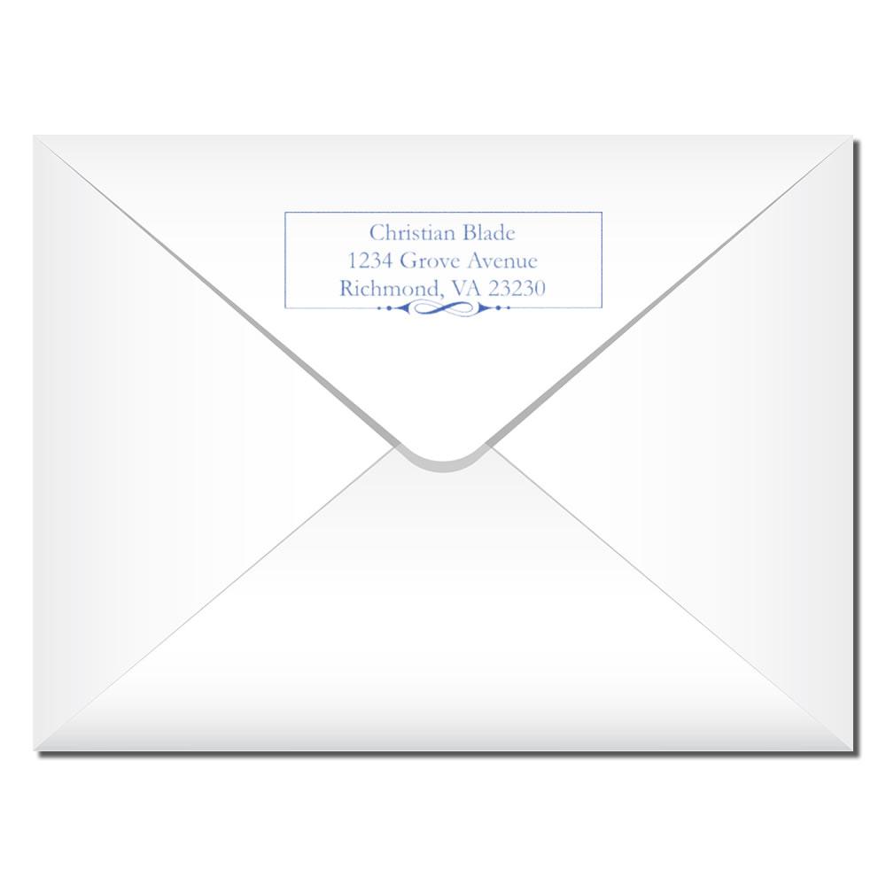 Personalized return address rubber stamp on white envelope for custom mailing labels