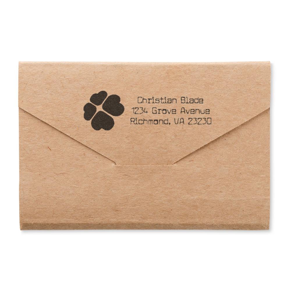Custom rubber stamp return address on kraft envelope with paw print logo for personalized mail