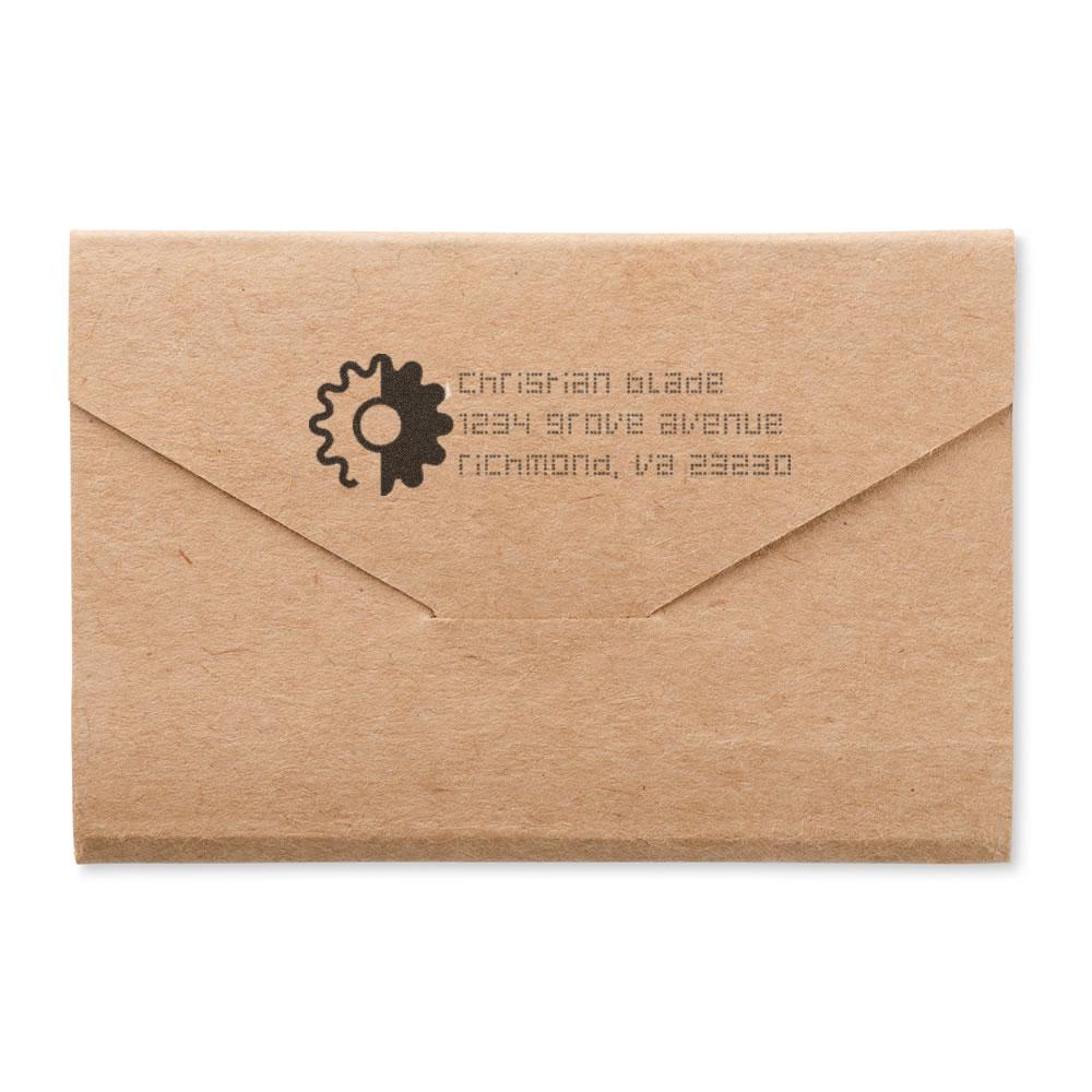 Custom rubber return address stamp on kraft envelope for branded small business mailings and packaging.