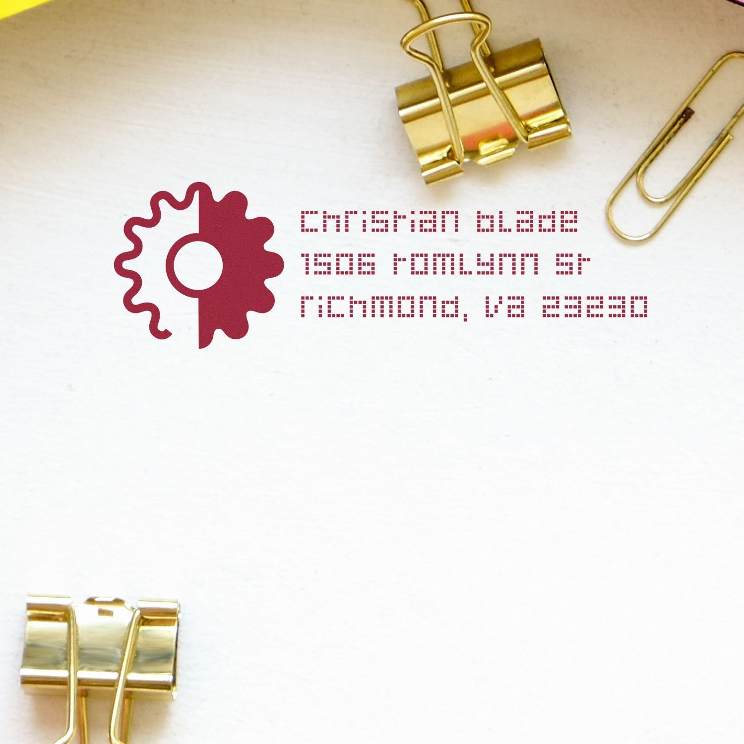 Custom business rubber stamp with logo and address, shown as an inked impression on white paper.