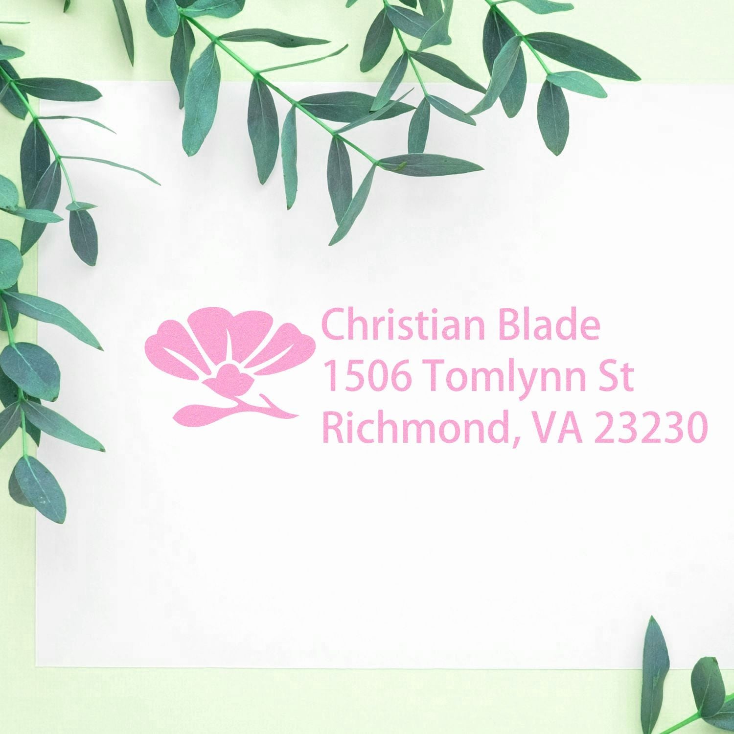 Custom pink rubber stamp with floral logo and return address for Christian Blade, Richmond, VA 23230.