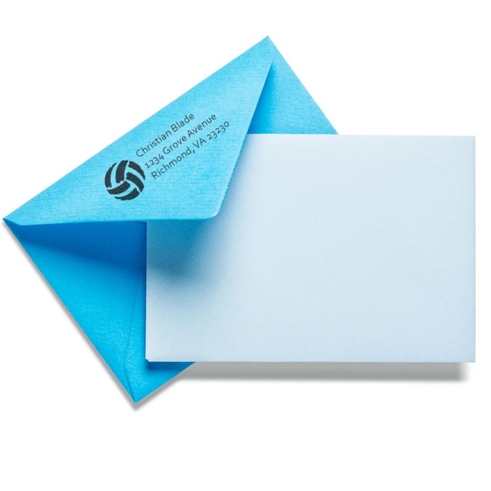 Custom rubber address stamp with logo on blue envelope for branded business mailings.