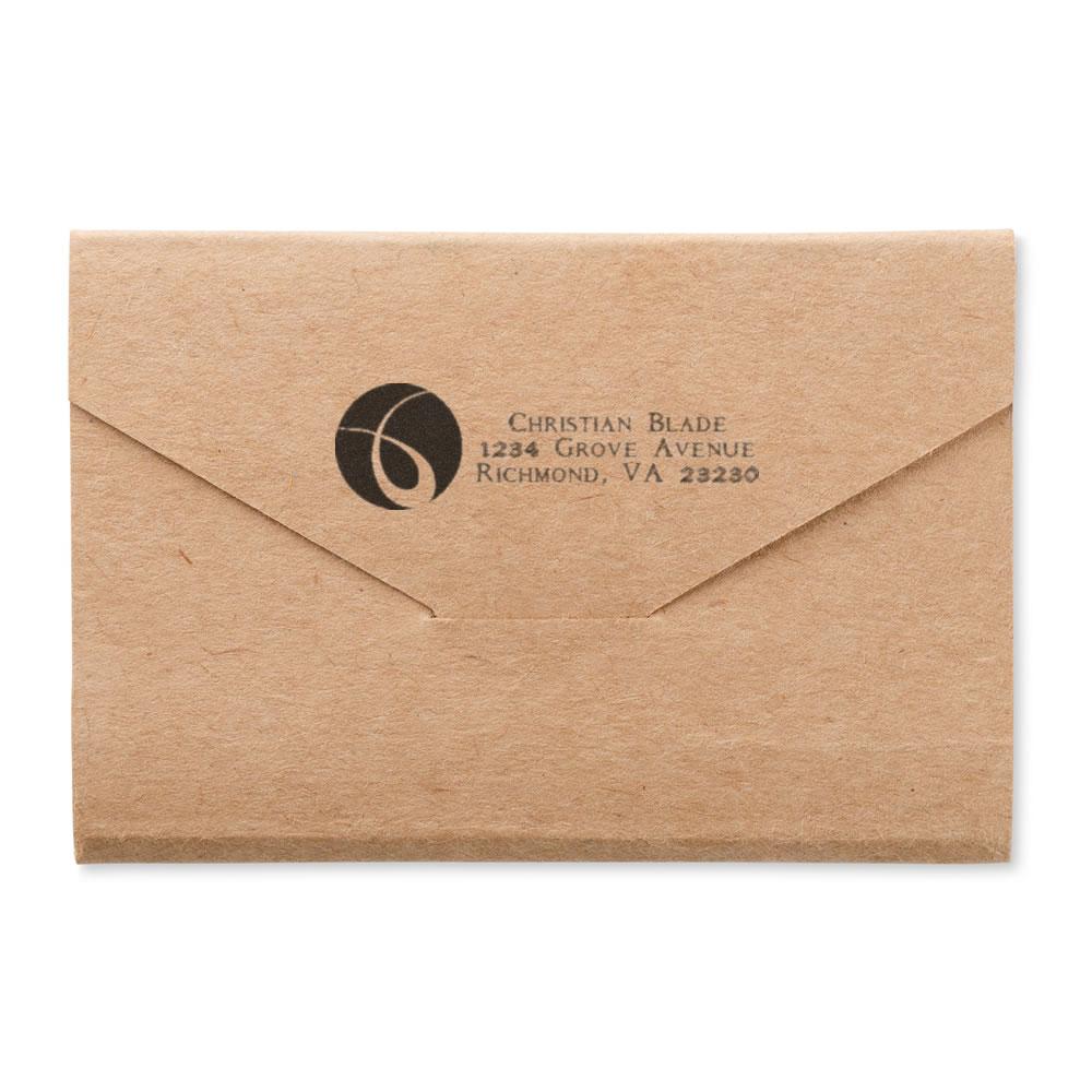 Personalized return address rubber stamp on kraft envelope with logo, perfect for business mail, wedding invites, and branding.