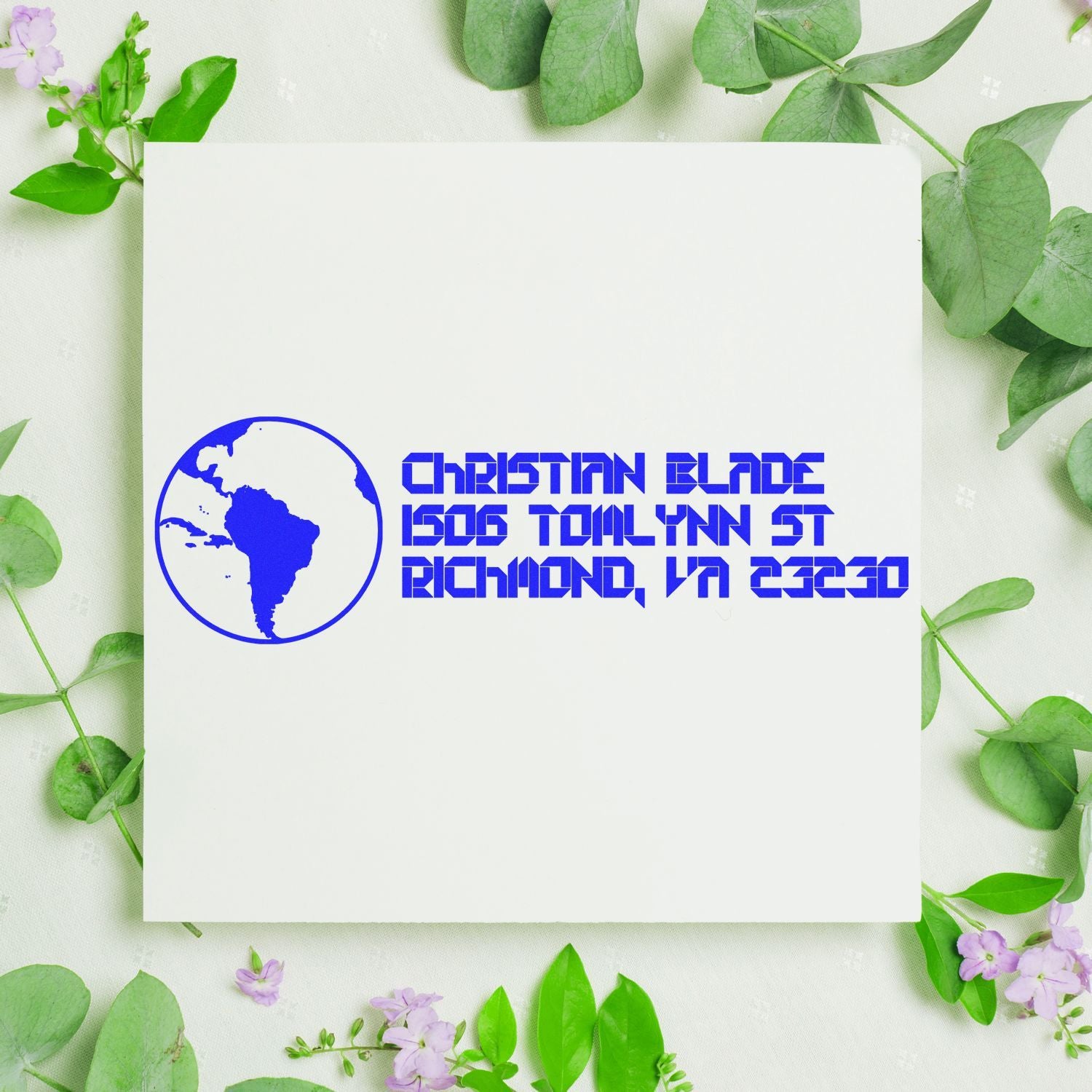 Custom rubber address stamp with globe logo and Christian Blade, 1506 Toinynn St, Richmond, VA 23230 in blue ink.