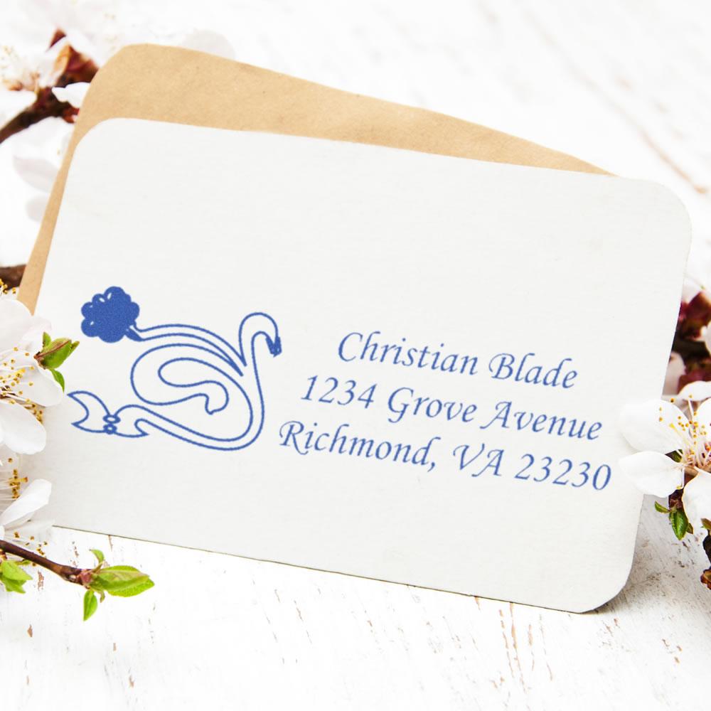 Custom return address rubber stamp with decorative bird logo on envelope, featuring name and Richmond, VA address.
