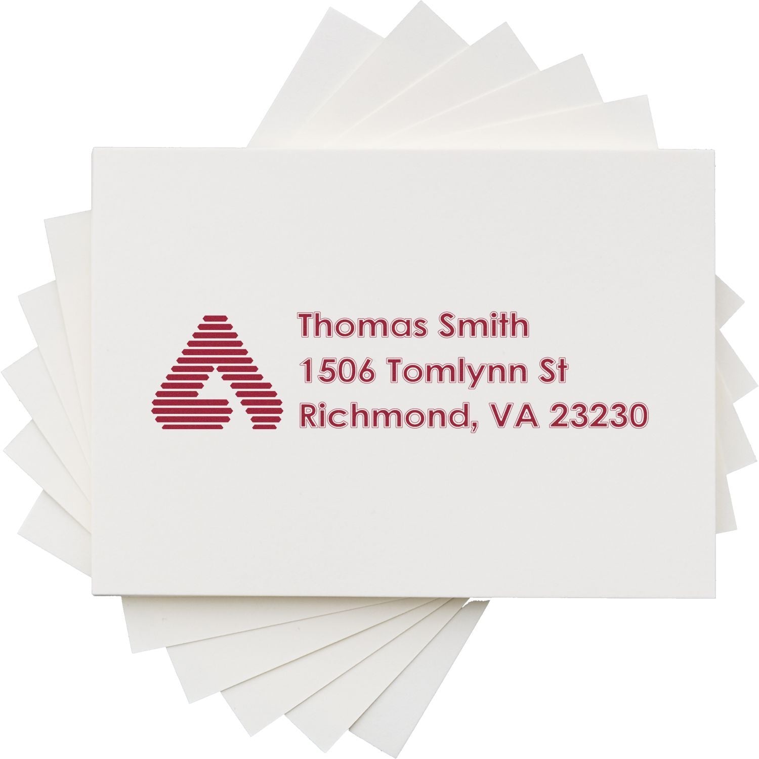 Custom return address rubber stamp with logo, Thomas Smith, Richmond, VA 23230, for personalized mailing envelopes.