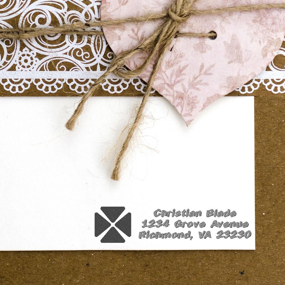 Custom return address rubber stamp for wedding invitations on rustic envelope with lace and twine.