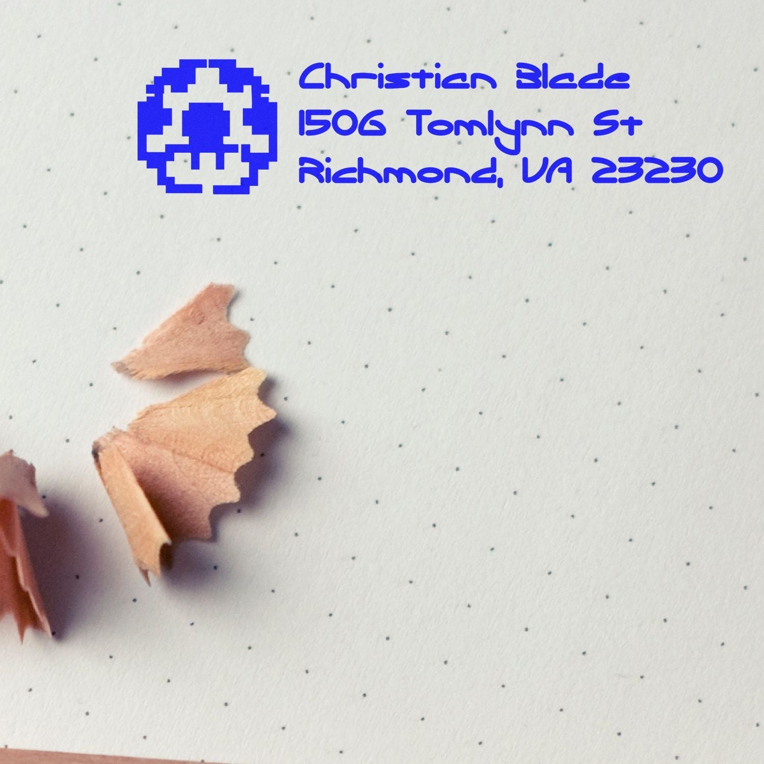 Custom rubber address stamp for Christian Bled, 1506 Tomlynn St, Richmond, VA 23230, shown in blue ink on paper.