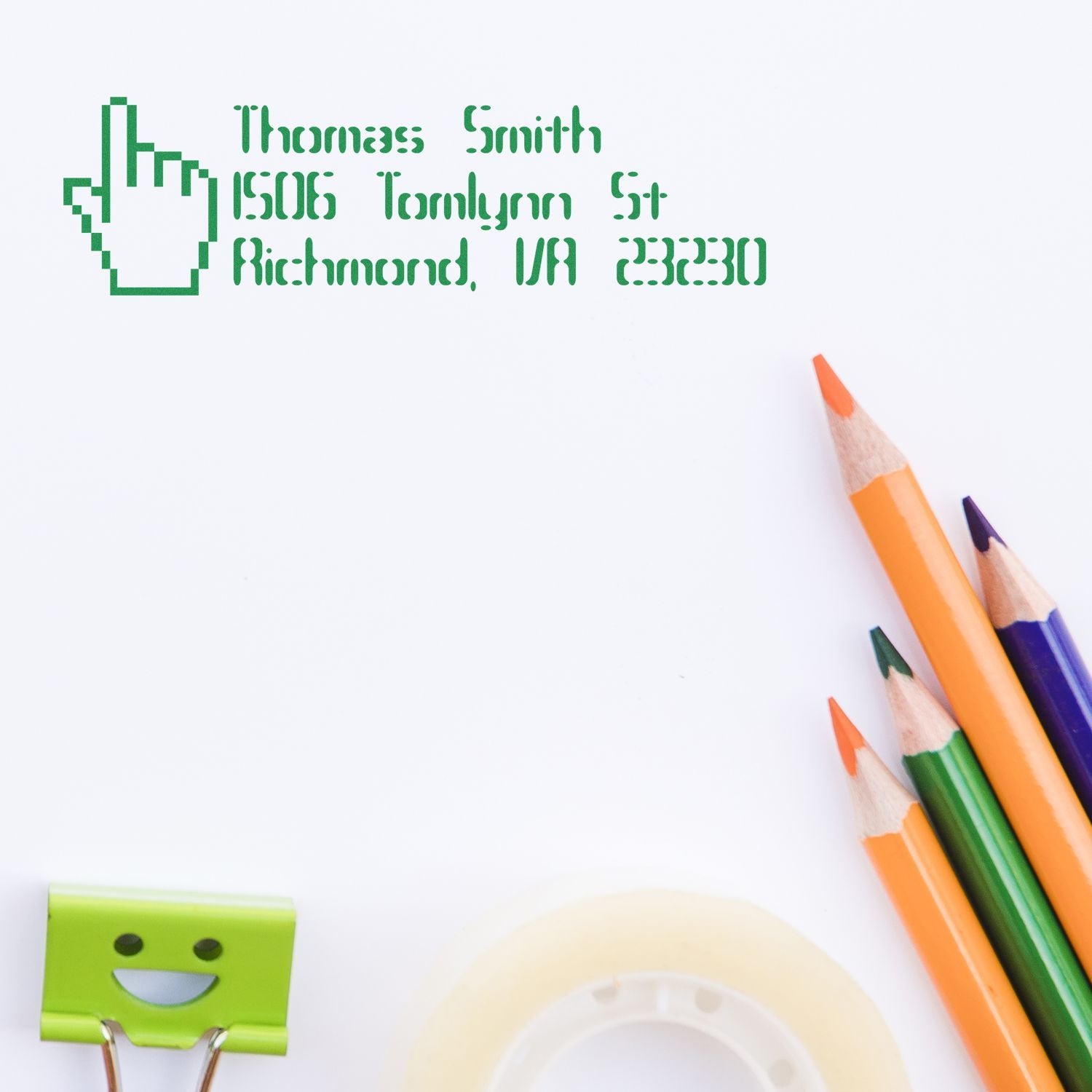 Custom rubber address stamp for Thomas Smith with Richmond, VA address, stamped on stationery beside colored pencils.