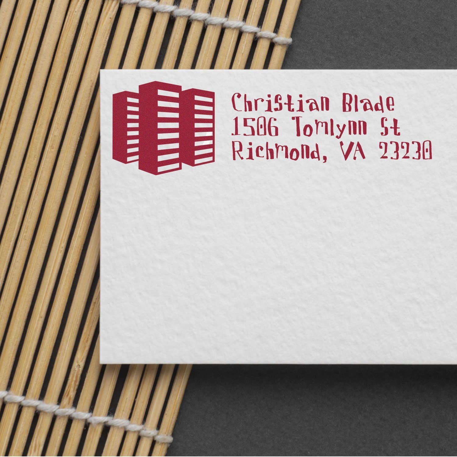 Custom return address rubber stamp for Christian Blade, Richmond VA, with logo on white envelope.