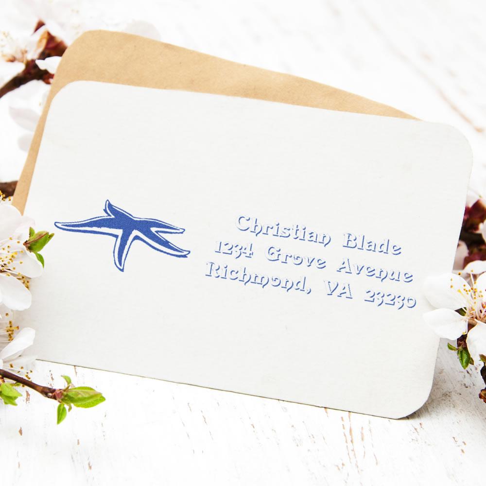 Personalized rubber return address stamp with logo on envelope for custom business mailings.