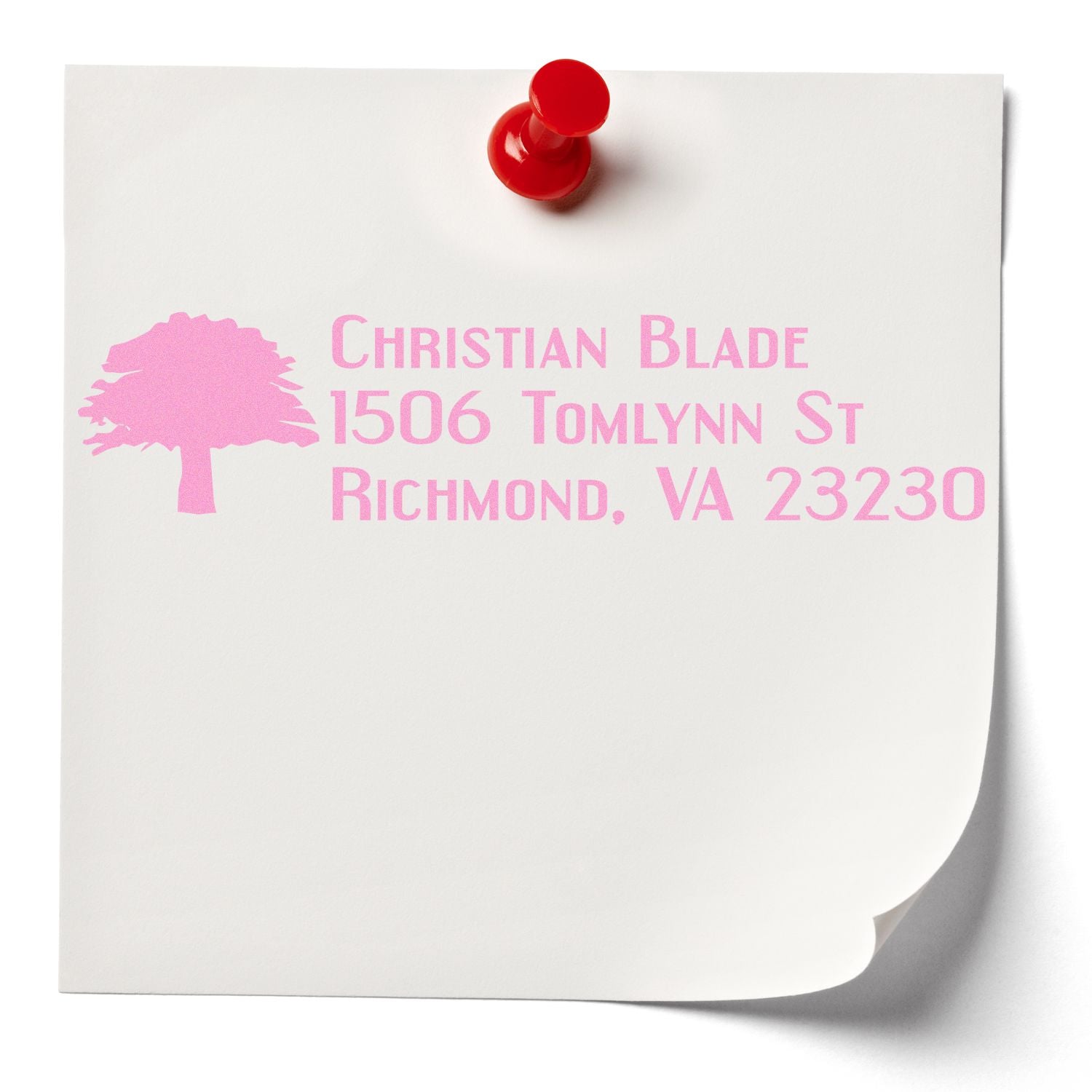 Custom return address rubber stamp with tree logo and pink ink, ideal for mailing envelopes and business stationery.