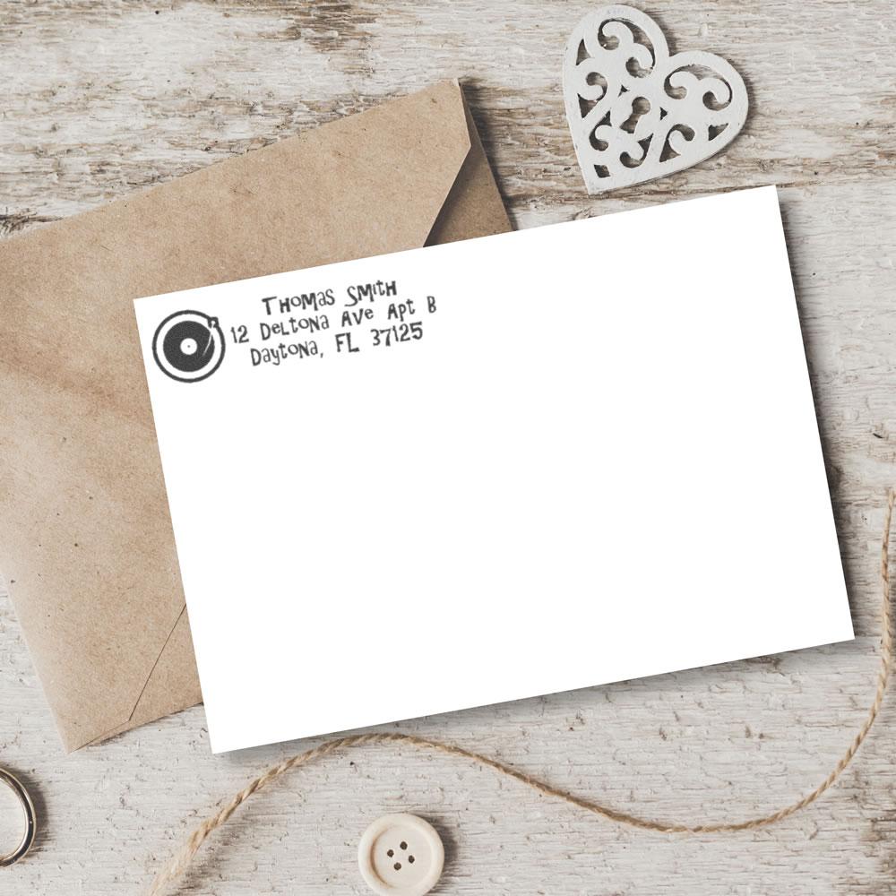 Custom return address rubber stamp on envelope, personalized with name and address for mail, invitations, and stationery.
