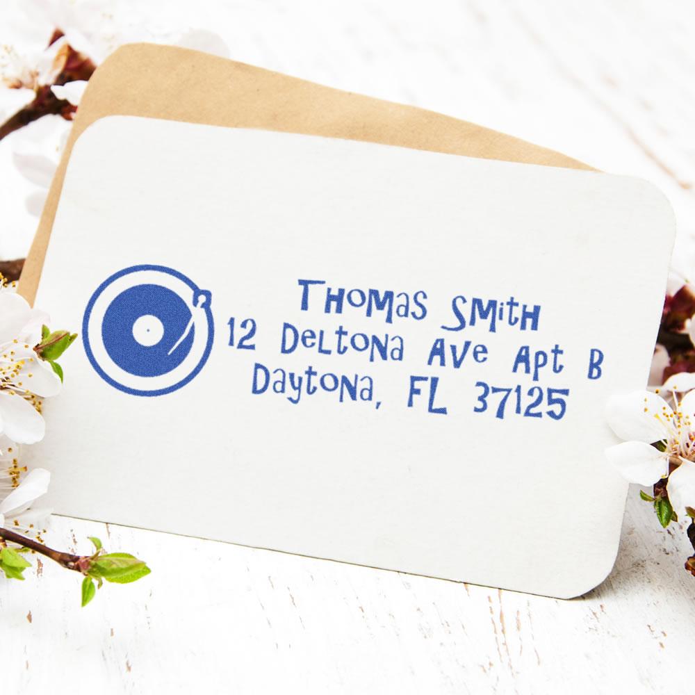 Custom return address rubber stamp with name and Florida address on envelope.