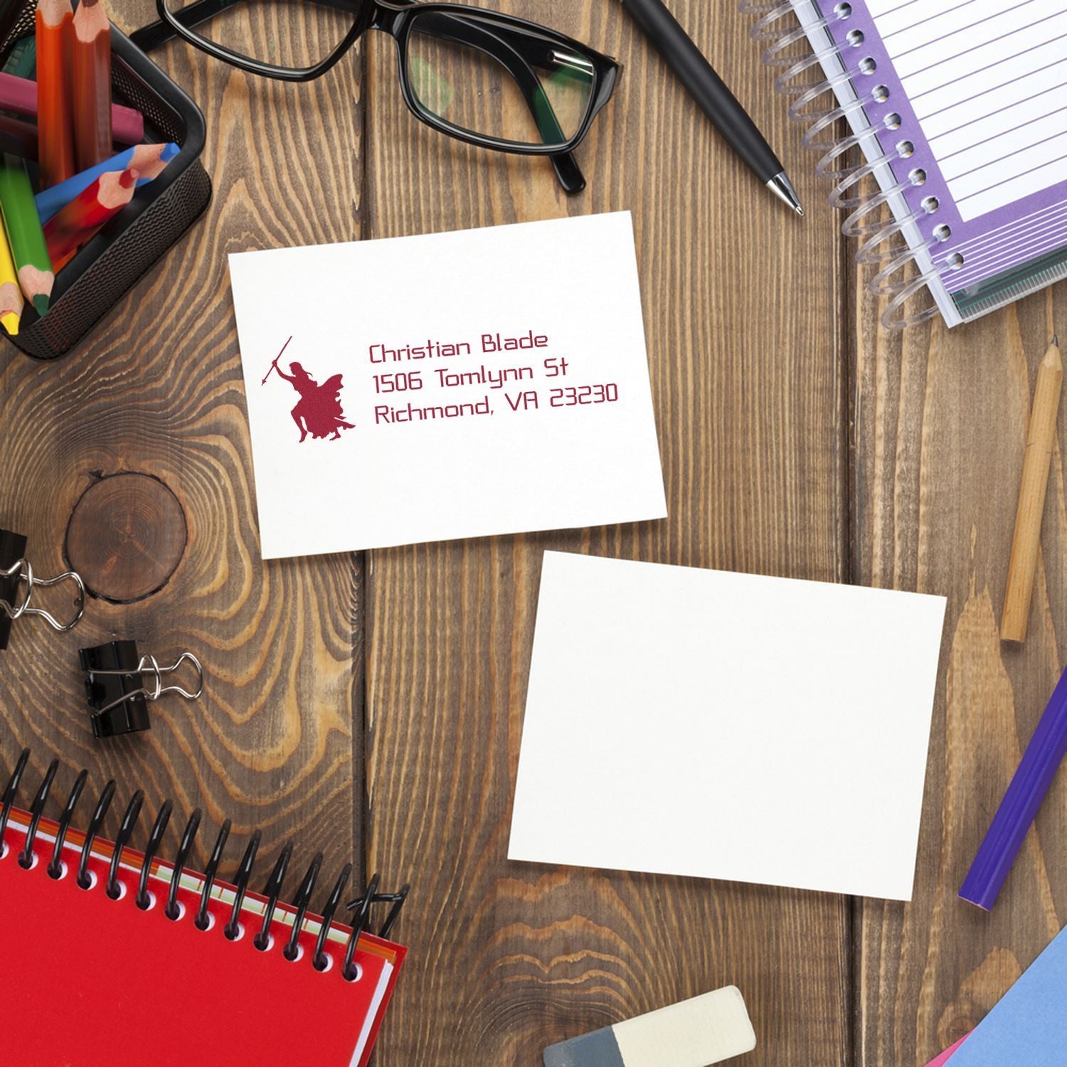Custom return address rubber stamp imprint on stationery, featuring logo and mailing details for business branding.