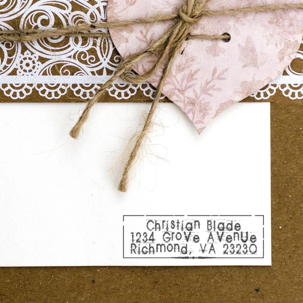 Custom return address rubber stamp on handmade wedding card with twine and lace, ideal for personalized envelope and gift packaging.