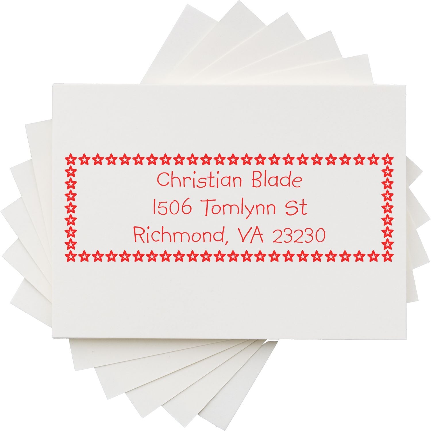 Custom address rubber stamp with red star border, showing a personalized return address for envelopes.