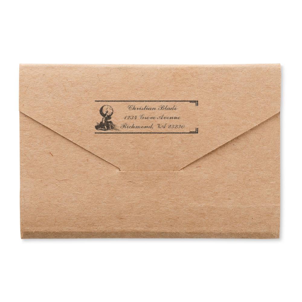 Custom return address rubber stamp on kraft envelope for weddings, business mail, and personalized stationery.